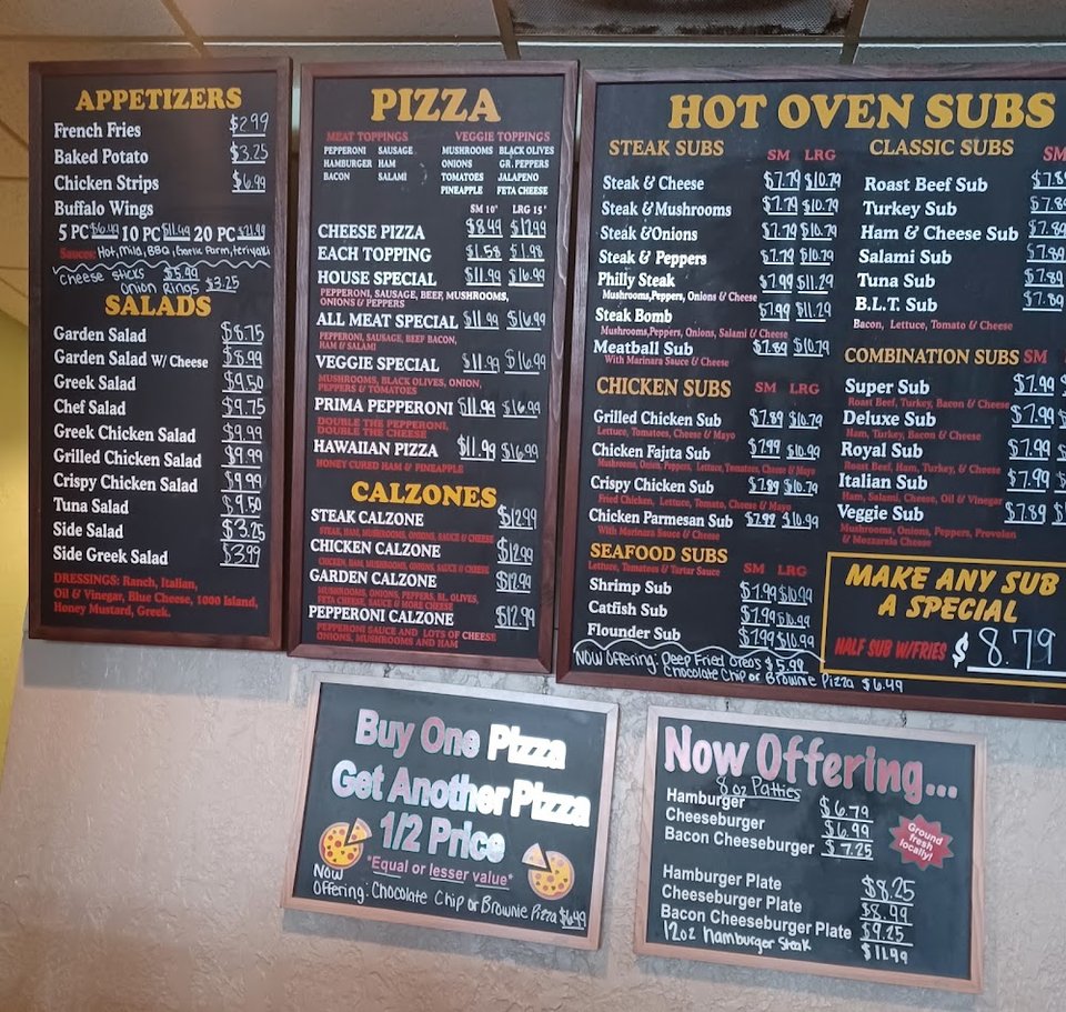 Menu board with classic sub and salad choices.